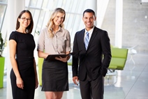 Businesspeople Having Informal Meeting In Modern Office