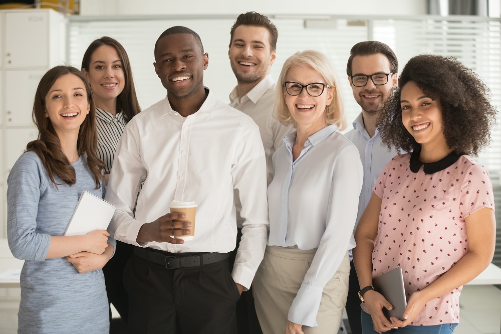 group of employees smiling at camera